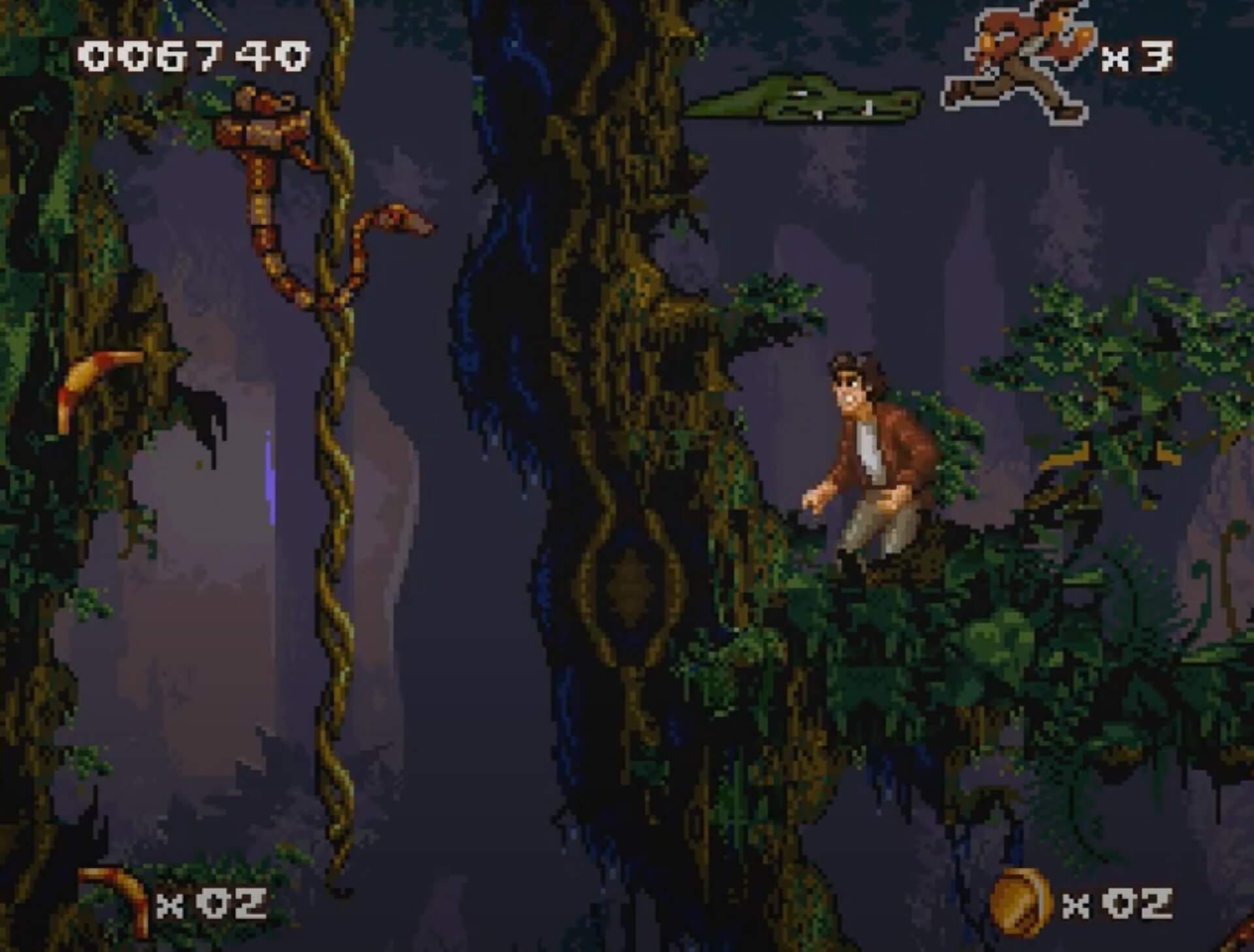 Pitfall The Mayan Adventure (SNES): Pitfall Junior versucht eine Schlange von der Liane zu vertreiben