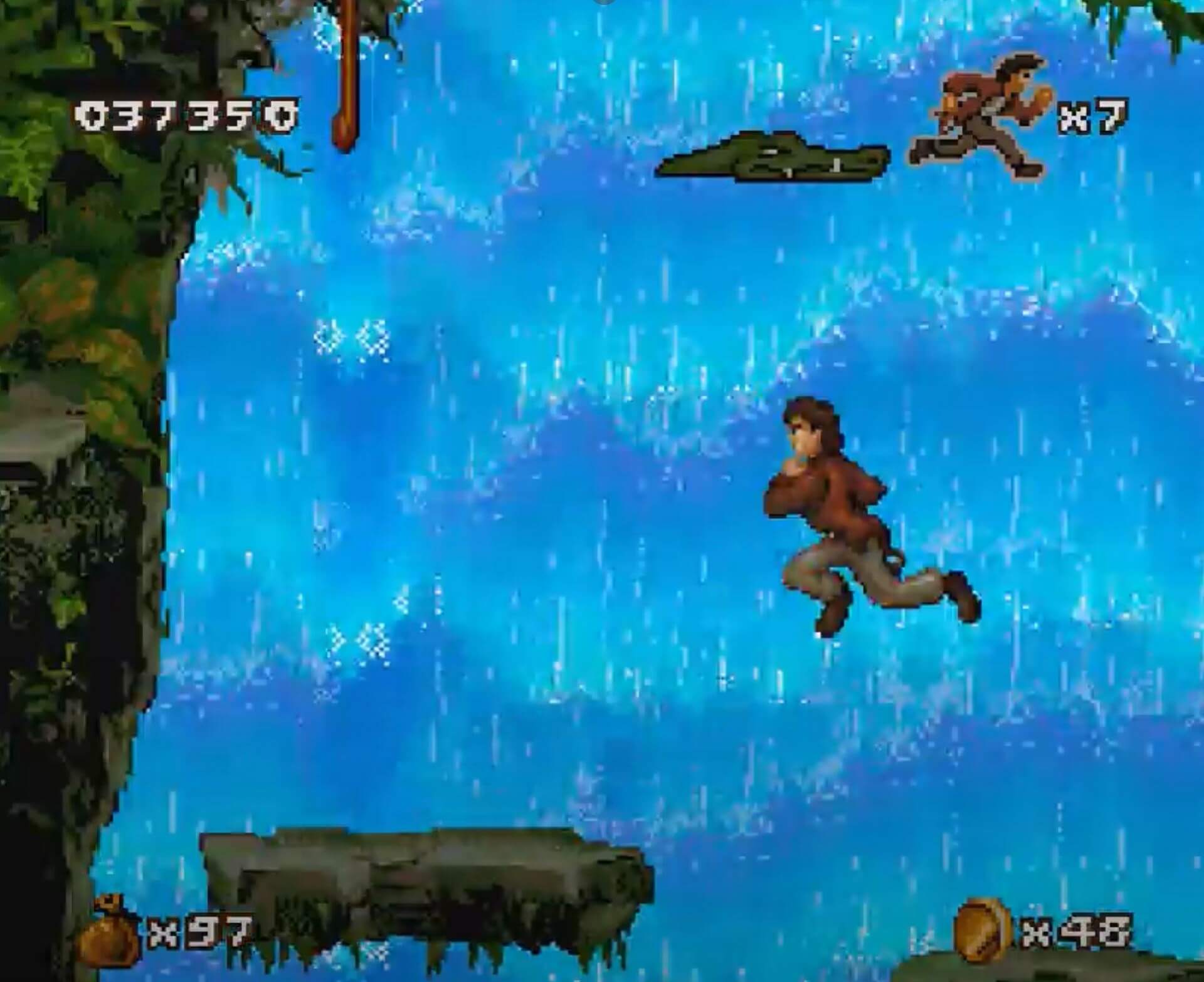 Pitfall The Mayan Adventure (SNES): Pitfall Junior springt über Felsen um einen Wasserfall zu überqueren